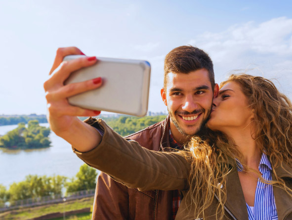 couple on cruise taking picture