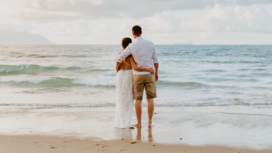 Newlywed Couple Walking on the BEach Newlywed Couple Walking on the Beach - New Zealand Destination Wedding